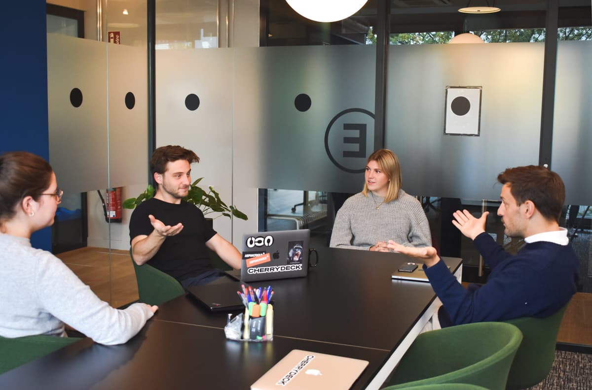 Modern startup workspace with digital tools and planning boards